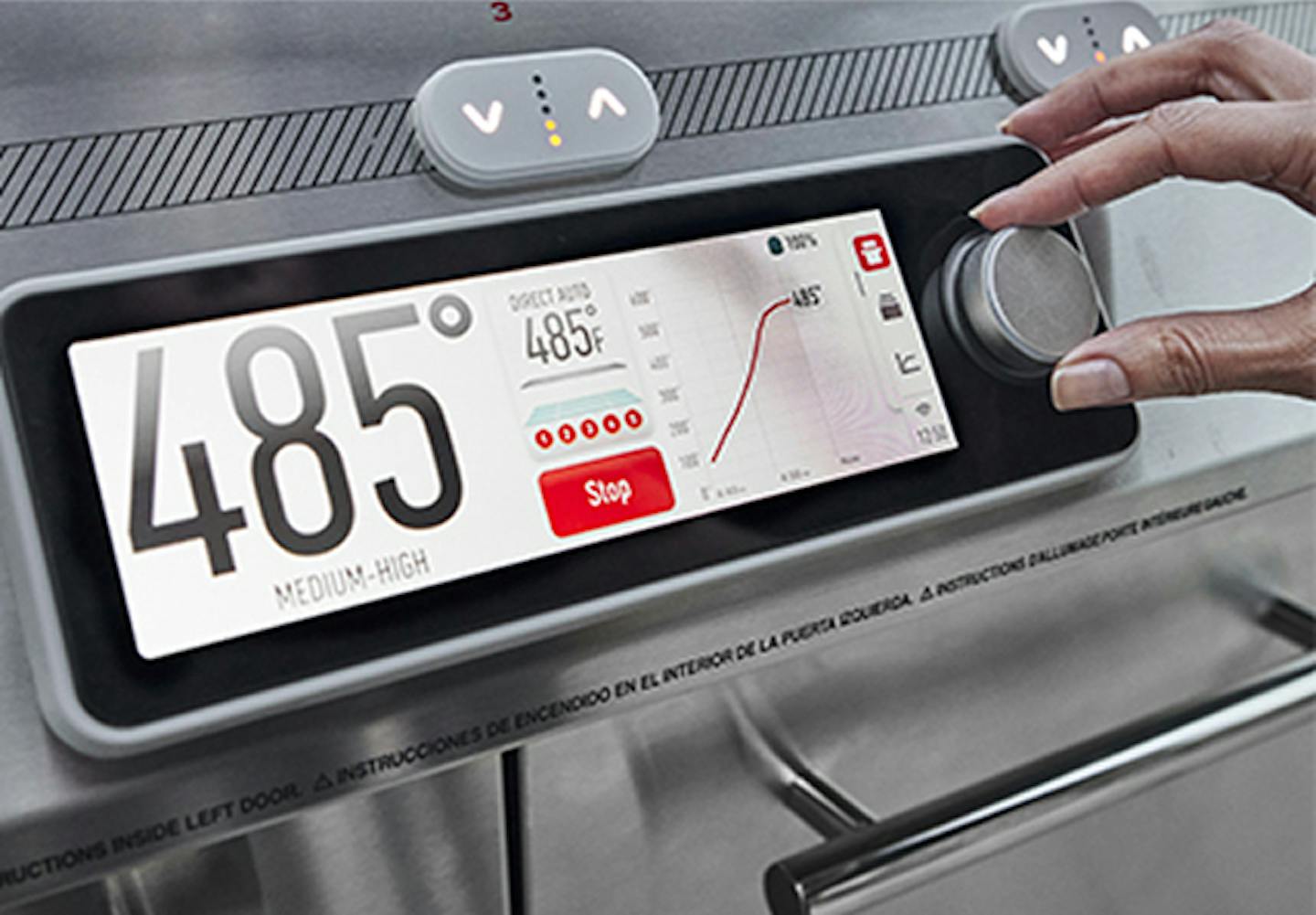 Touchscreen grill interface showing cooking settings, with a user tapping to adjust temperature and monitor progress