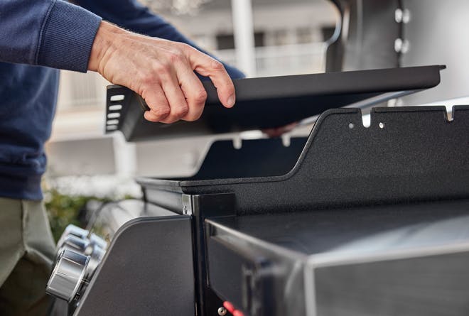 Weber gas grill, griddle inserted