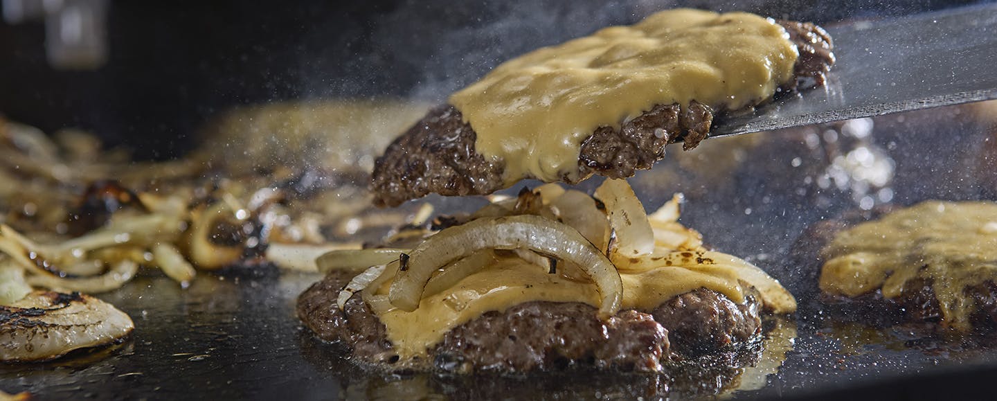 Grilling burger on the Weber Griddle